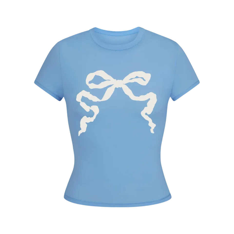 Maglietta cropped azzurra con fiocco in cotone